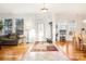 Bright and spacious entryway with hardwood floors and coat rack at 8814 Beaver Creek Dr, Charlotte, NC 28269