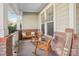 Inviting front porch with rocking chairs and decorative accents at 8814 Beaver Creek Dr, Charlotte, NC 28269