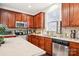 Kitchen with wood cabinets, granite countertop, and stainless steel appliances at 8814 Beaver Creek Dr, Charlotte, NC 28269