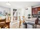 Open concept kitchen featuring an island with seating, granite countertops, and stainless steel appliances at 8814 Beaver Creek Dr, Charlotte, NC 28269