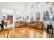 Open living room with hardwood floors, comfortable seating, and natural light at 8814 Beaver Creek Dr, Charlotte, NC 28269