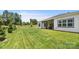 Fenced backyard with covered patio and well-manicured lawn at 917 Black Beard Dr, Denver, NC 28037