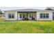 Large backyard with grassy lawn and covered patio at 917 Black Beard Dr, Denver, NC 28037