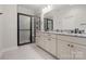 Modern bathroom featuring double sinks and a frameless shower at 917 Black Beard Dr, Denver, NC 28037