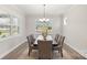 Elegant dining room with chandelier, large windows, and seating for six at 917 Black Beard Dr, Denver, NC 28037