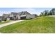 Home's exterior showcases a side view of the home with landscaping and driveway at 917 Black Beard Dr, Denver, NC 28037