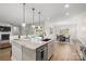 Open concept kitchen with large island, stainless steel appliances, and granite countertops at 917 Black Beard Dr, Denver, NC 28037