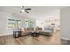 Spacious living room featuring L-shaped sectional and views into the kitchen area at 917 Black Beard Dr, Denver, NC 28037