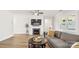 Living room showcasing fireplace, sectional sofa, and built-in shelving at 917 Black Beard Dr, Denver, NC 28037