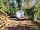 Small backyard with shed and wooden stairs at 1116 East Dr, Gastonia, NC 28052