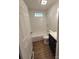 Updated bathroom with white subway tile and dark vanity at 1116 East Dr, Gastonia, NC 28052