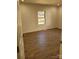 Bright bedroom featuring light walls and wood-look floors at 1116 East Dr, Gastonia, NC 28052