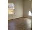 Bright bedroom with wood-look floors and large window at 1116 East Dr, Gastonia, NC 28052