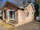 Newly renovated stone house with large windows at 1116 East Dr, Gastonia, NC 28052