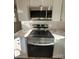Stainless steel range and microwave in updated kitchen at 1116 East Dr, Gastonia, NC 28052