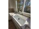 Farmhouse sink and modern faucet in a bright kitchen at 1116 East Dr, Gastonia, NC 28052