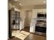 Modern kitchen with stainless steel appliances and white cabinets at 1116 East Dr, Gastonia, NC 28052