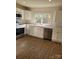 Modern kitchen with white cabinets and stainless steel appliances at 1116 East Dr, Gastonia, NC 28052