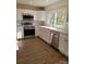 Modern kitchen with white cabinets and stainless steel appliances at 1116 East Dr, Gastonia, NC 28052
