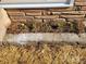 Stone planter with pine straw and early spring flowers at 1116 East Dr, Gastonia, NC 28052