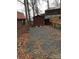Gravel backyard with storage shed and lake view at 119 River Ridge Trl # E175/176, Mount Gilead, NC 27306