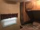Bedroom with window, closet, and overhead cabinet at 119 River Ridge Trl # E175/176, Mount Gilead, NC 27306