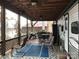 Covered patio with seating and lake view at 119 River Ridge Trl # E175/176, Mount Gilead, NC 27306