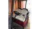 Golf cart interior with off-white seats at 119 River Ridge Trl # E175/176, Mount Gilead, NC 27306