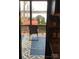 Screened porch overlooking lake with chair and rug at 119 River Ridge Trl # E175/176, Mount Gilead, NC 27306