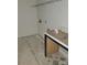 A laundry room with open shelving and a countertop area at 13618 Tranquil Day Dr, Matthews, NC 28105