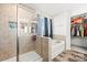 Beautiful bathroom featuring a shower, tub, tile flooring, and a walk-in closet at 144 Mooring Dr, Statesville, NC 28677