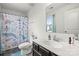 A modern bathroom offers a vanity with a sink and a bathtub with shower featuring a fun curtain at 144 Mooring Dr, Statesville, NC 28677