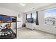 A bright bedroom provides a comfortable space with plenty of natural light and a mounted television at 144 Mooring Dr, Statesville, NC 28677