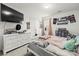 Bright bedroom features a dresser, mounted television, and a large window for natural light at 144 Mooring Dr, Statesville, NC 28677