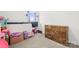 Comfortable carpeted bedroom with dresser and alphabet design great for and storage at 144 Mooring Dr, Statesville, NC 28677