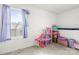 Cozy bedroom features a window view and pink doll house perfect for play and imagination at 144 Mooring Dr, Statesville, NC 28677