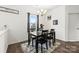 Cozy dining room featuring a dark wood table, black chairs, and natural light at 144 Mooring Dr, Statesville, NC 28677