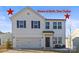 Two-story house with white siding, dark accents, and a two-car garage at 144 Mooring Dr, Statesville, NC 28677