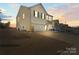 Charming two-story home with attached garage and beautiful lawn in a suburban neighborhood at 144 Mooring Dr, Statesville, NC 28677