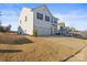 Exterior features a driveway leading up to the attached garage, a lawn, and a walkway at 144 Mooring Dr, Statesville, NC 28677