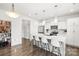 Bright, white eat-in kitchen with modern appliances, spacious island and stylish pendant lighting at 144 Mooring Dr, Statesville, NC 28677