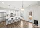 Bright and white kitchen with a large island and stainless steel appliances at 144 Mooring Dr, Statesville, NC 28677