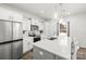 This eat-in kitchen includes white cabinetry and stainless steel appliances at 144 Mooring Dr, Statesville, NC 28677