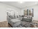 Open concept living room showing large gray sectional at 144 Mooring Dr, Statesville, NC 28677