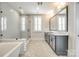 Elegant bathroom with double vanity, soaking tub, and glass shower at 1812 Pin Oak Ct, Fort Mill, SC 29715