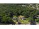 Aerial view of two single-Gathering homes with long driveways surrounded by a lush, green forest at 2227 Charlotte Hwy, York, SC 29745