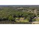 Bird's-eye view of two homes nestled within a vast, verdant landscape surrounded by trees at 2227 Charlotte Hwy, York, SC 29745