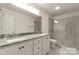A bathroom with granite counters, dual sinks and a glass shower at 2227 Charlotte Hwy, York, SC 29745
