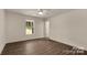 Bedroom featuring a window, ceiling fan, and wood-look floors at 2227 Charlotte Hwy, York, SC 29745