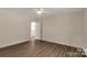 Bedroom with wood-look flooring, neutral walls, and ceiling fan at 2227 Charlotte Hwy, York, SC 29745
